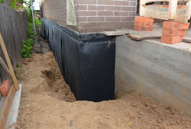 Happy homeowners after waterproofing job in Hilbert